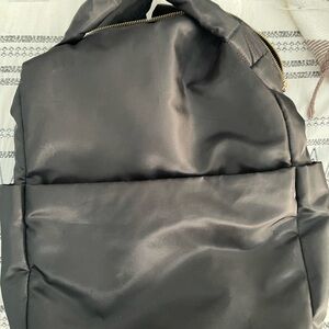 a new day Black Backpack